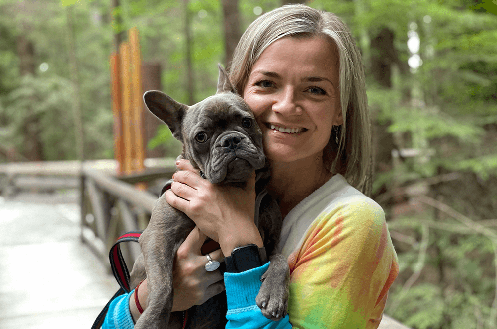 Woman holding small dog