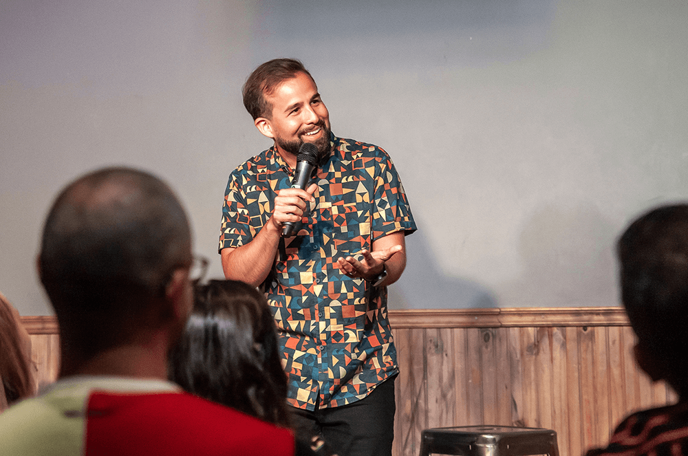 Man holding microphone at comedy club