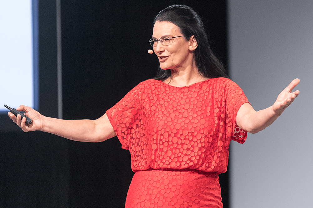 Woman using hand gestures onstage